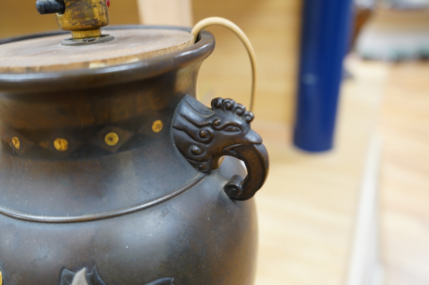 A Japanese bronze and precious metal overlaid vase, Meiji period fitted as a table lamp, 35.5cm high. Condition - drilled for cable, grubby otherwise good.